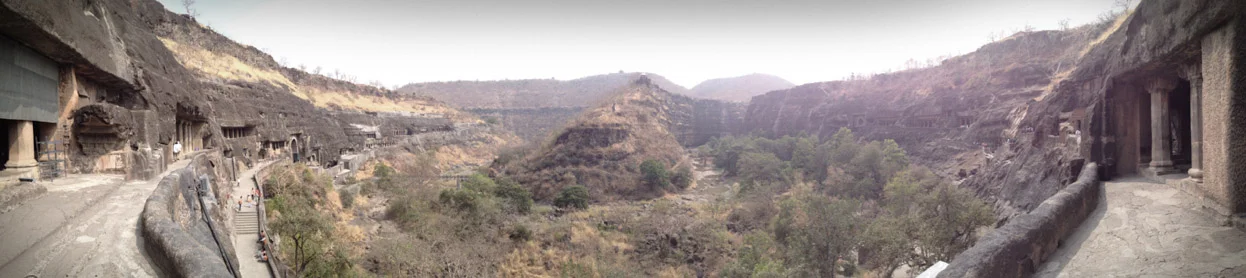Panoramic view from the middle of the horseshoe-shaped ravine where the caves sit