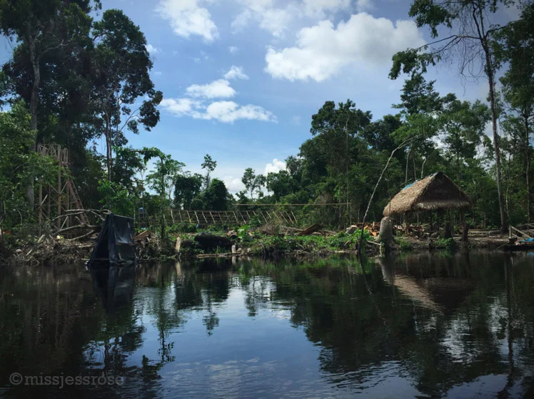Approaching the Cuninico oil spill site, oil worker's encampment