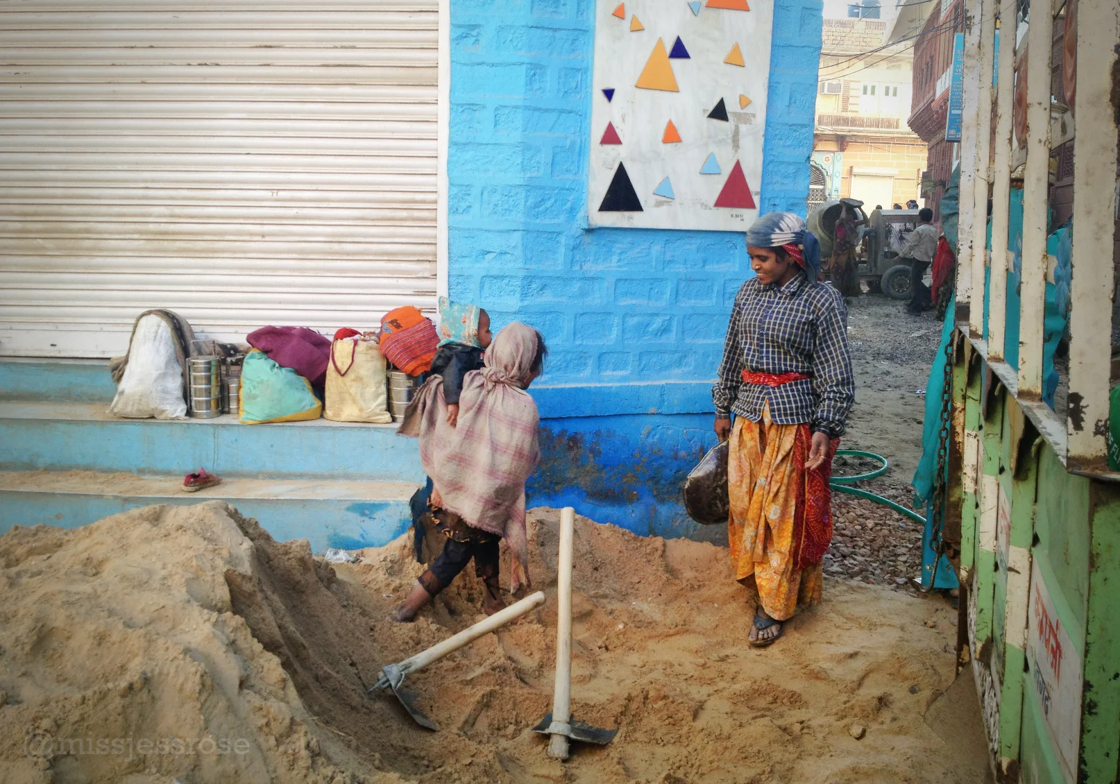 Another mother working manual labor at a construction site. 