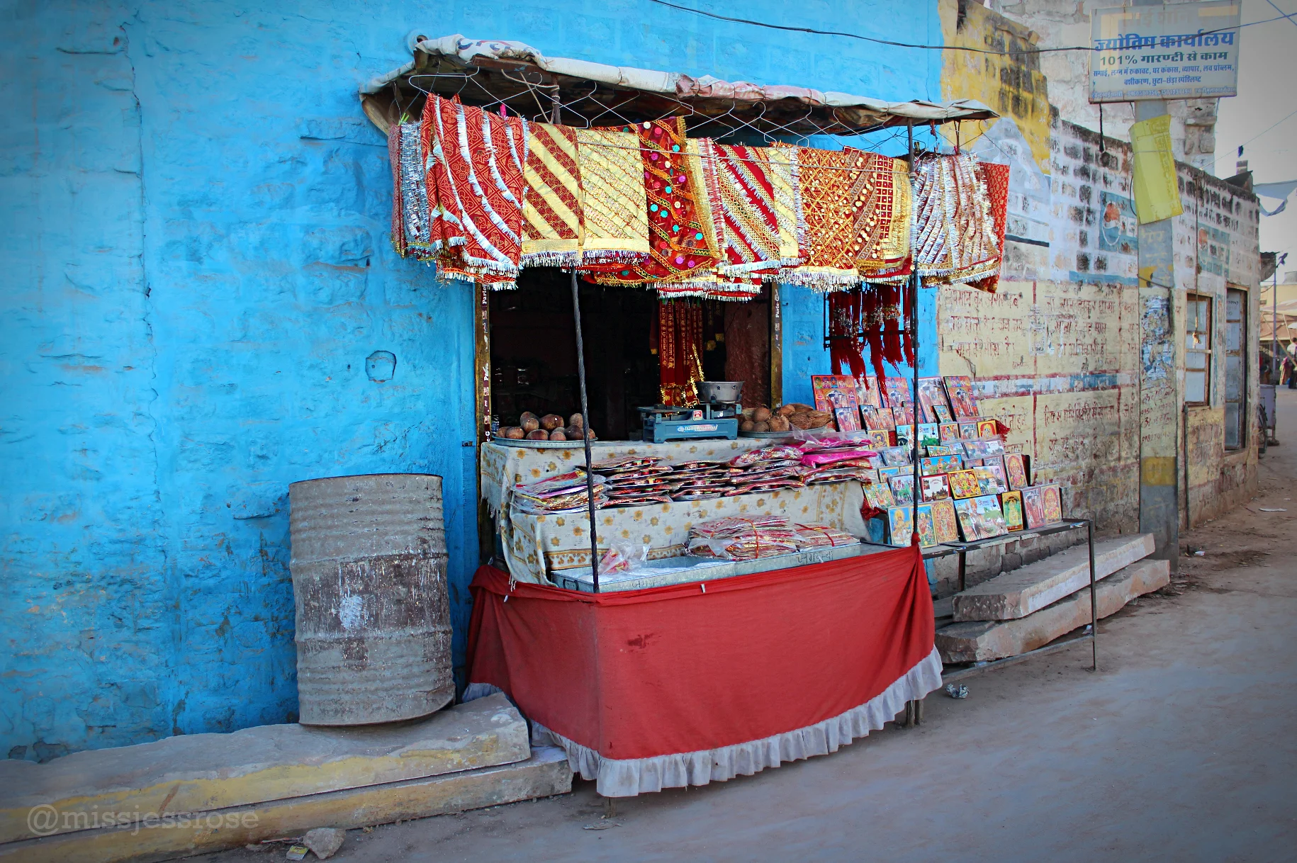 Stands selling prasad (offerings) and more line the road towards the temple.