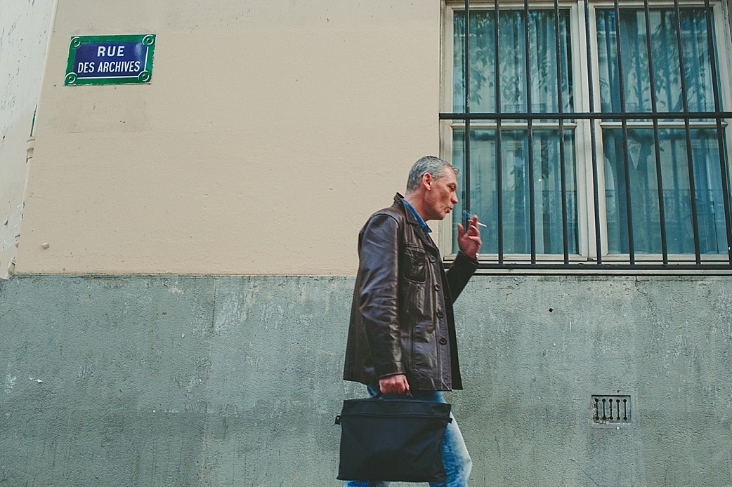 smoking man on the street in paris