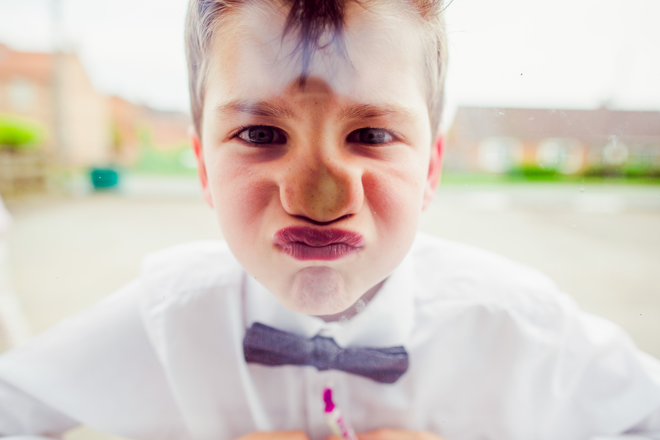 kids at wedding - face against the glass - yorkshire wedding 