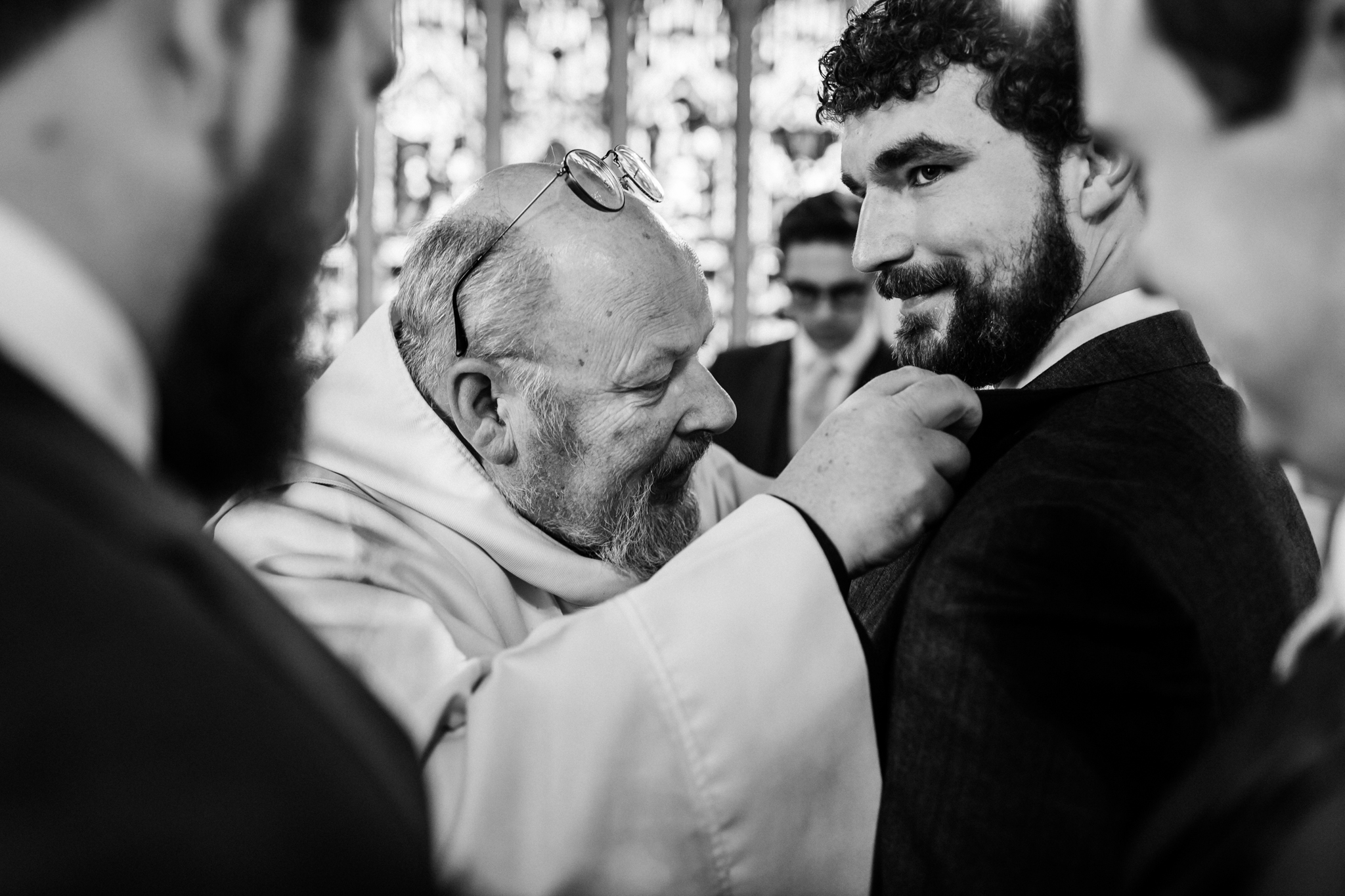 priest puts on a flower