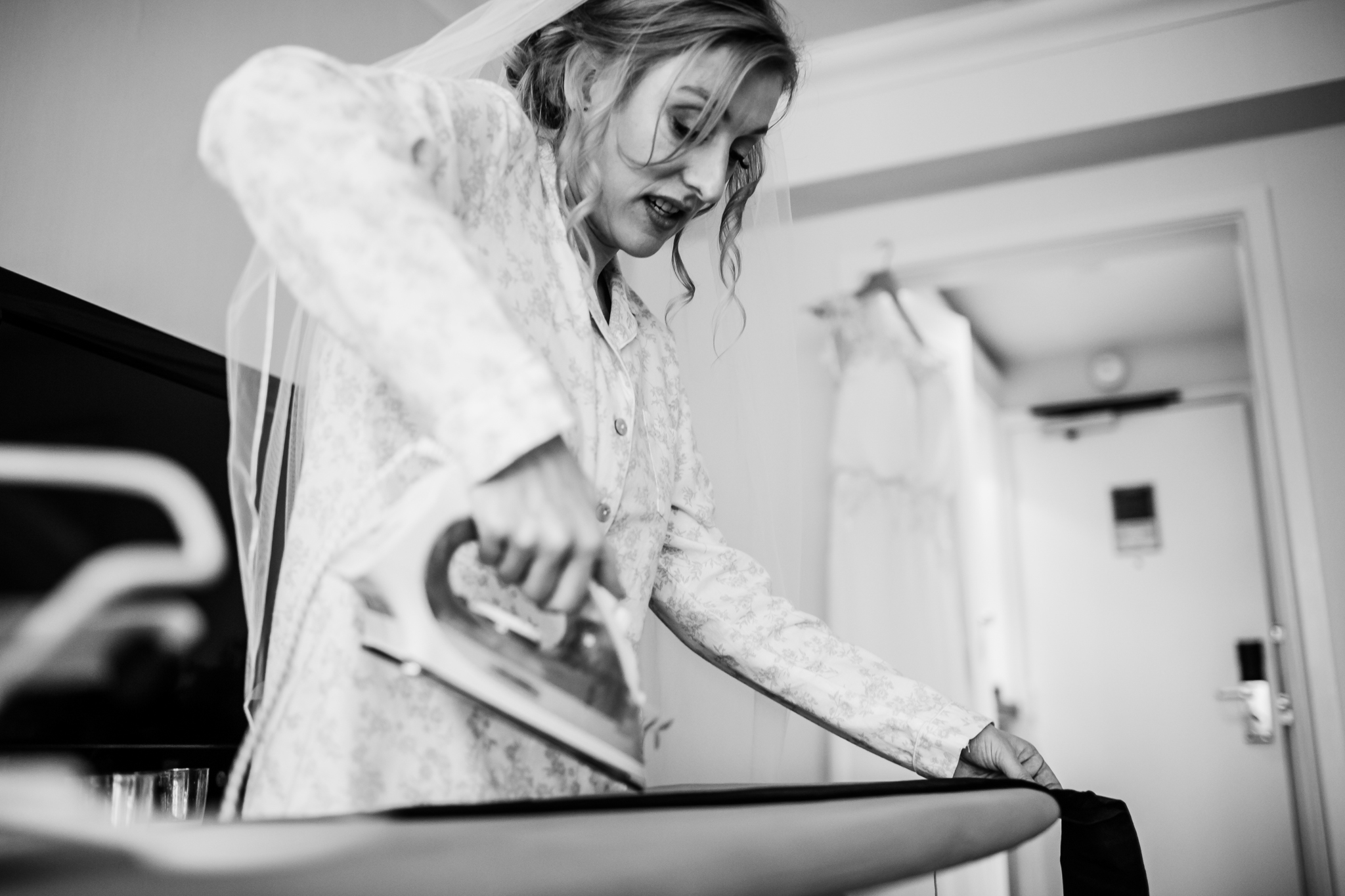 bride ironing her dress