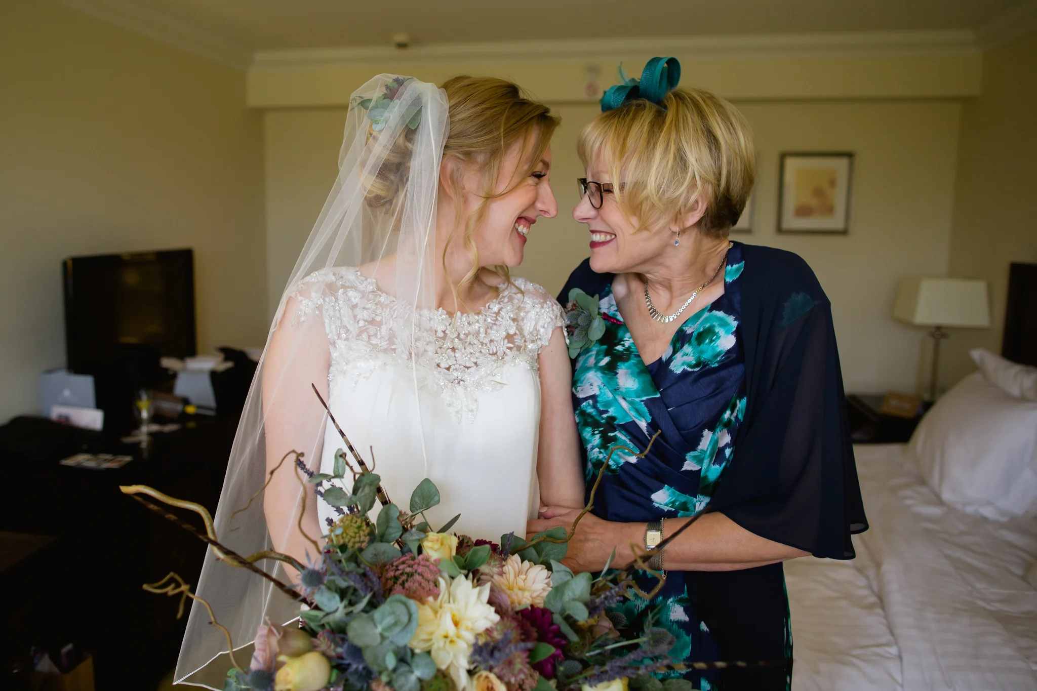 mother and daughter giggling