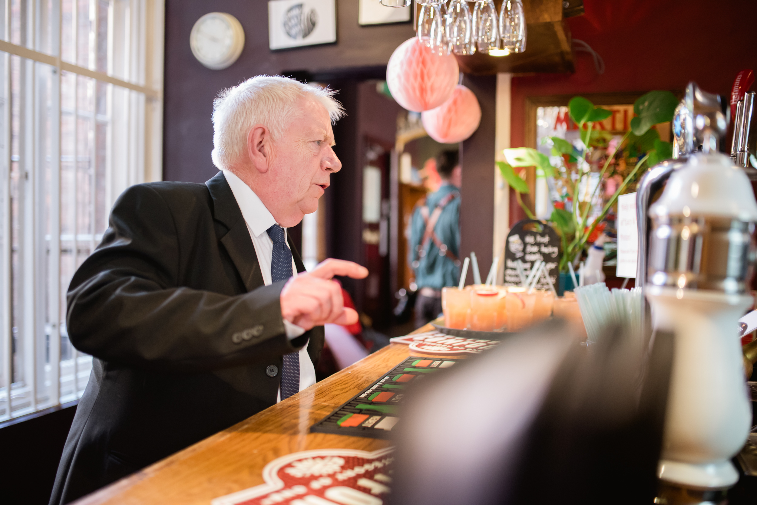 wedding guest ordering a drink at Cherry Reds