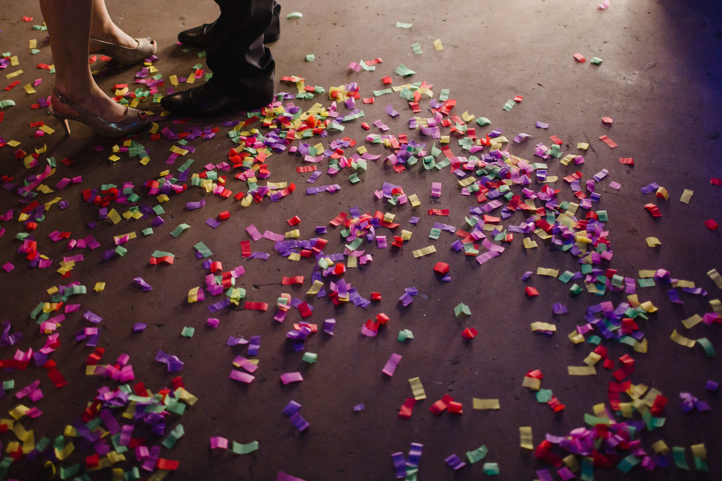 Spent confetti on the dance floor of a wedding