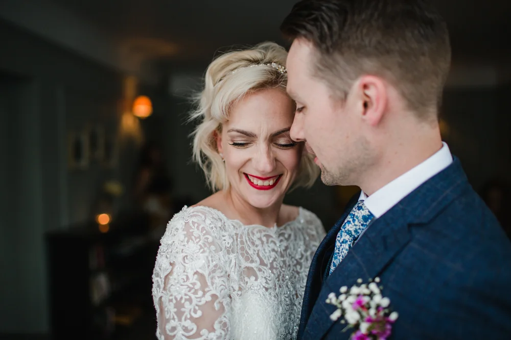 a bride and groom embrace after their wedding ceremony at the rosevine hotel truro cornwall 