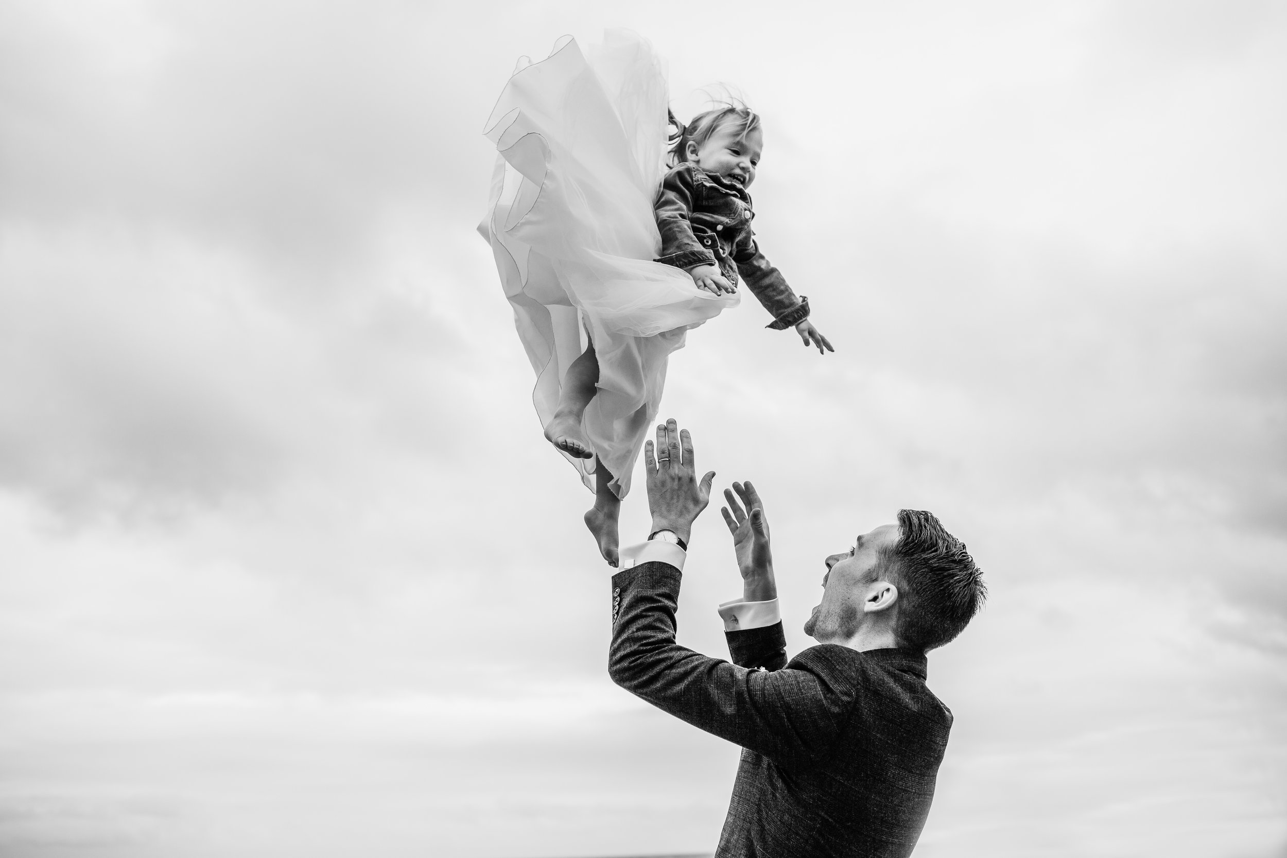 A groom throws his daughter in the air at rosevine hotel truro cornwall