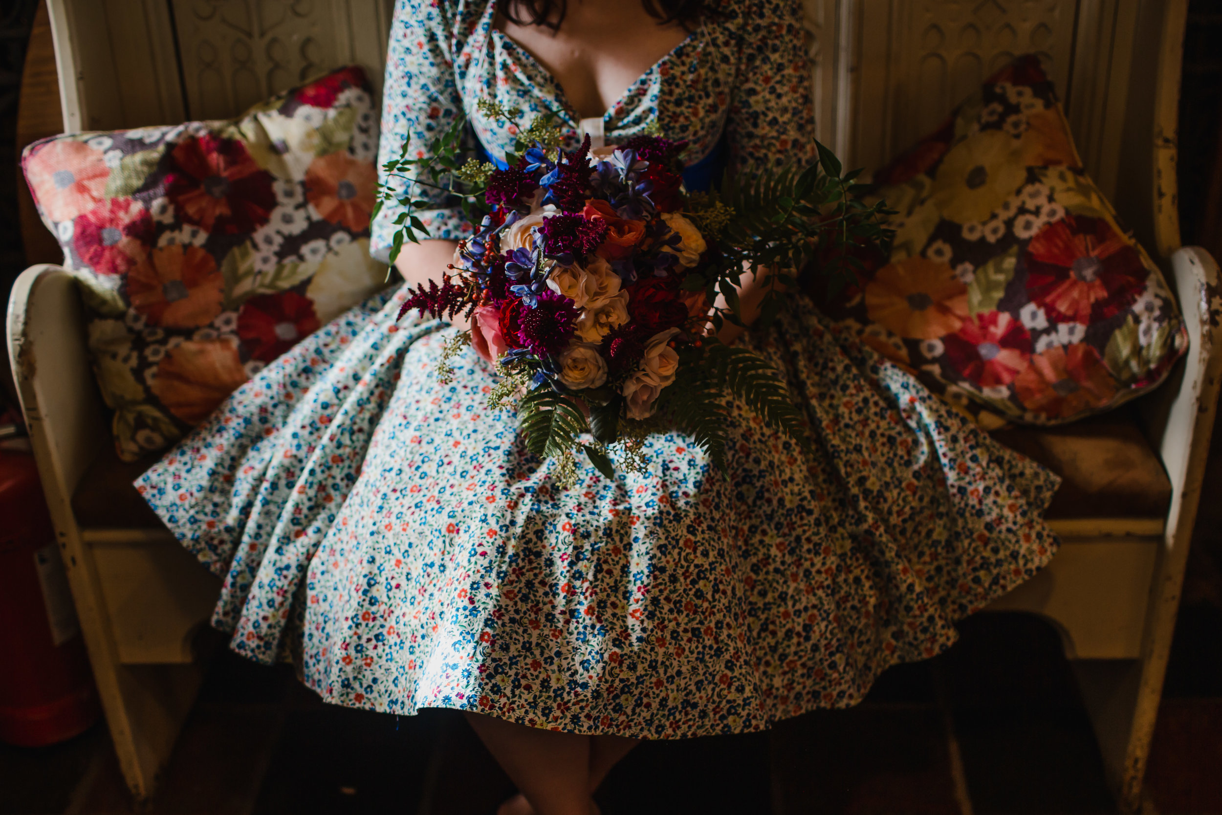 a bride and her flowers at The Red Barn