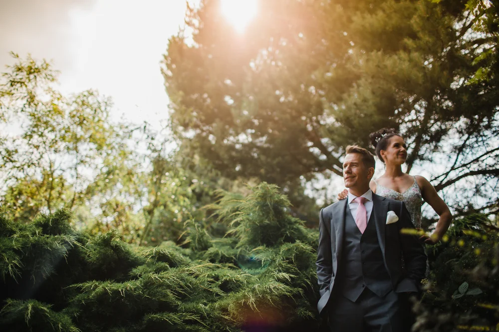 a bride and groom pose for a portrait at yorkshire sculpture park