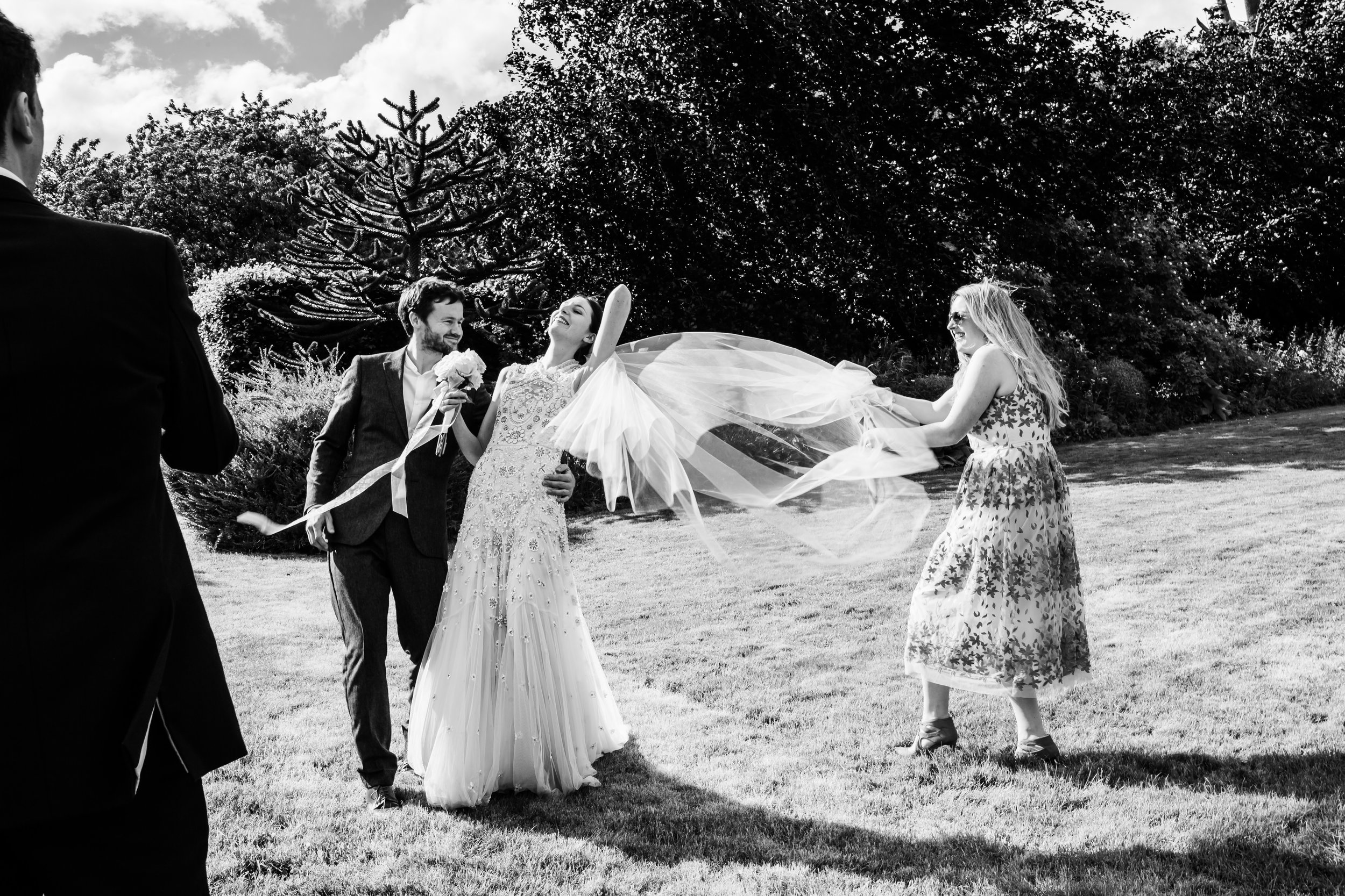 A brides veil blows in the wind