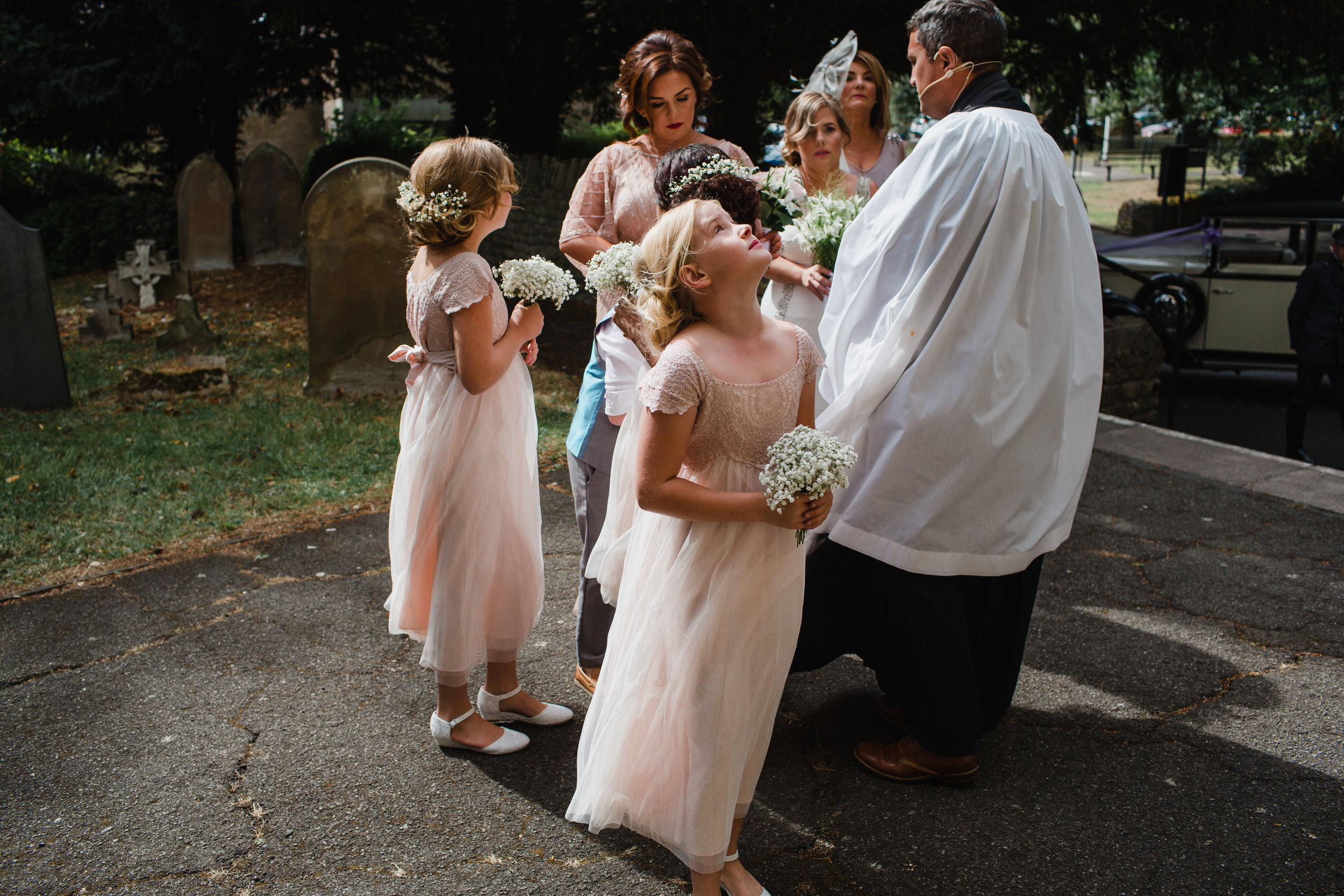 flower girls and the priest in corby