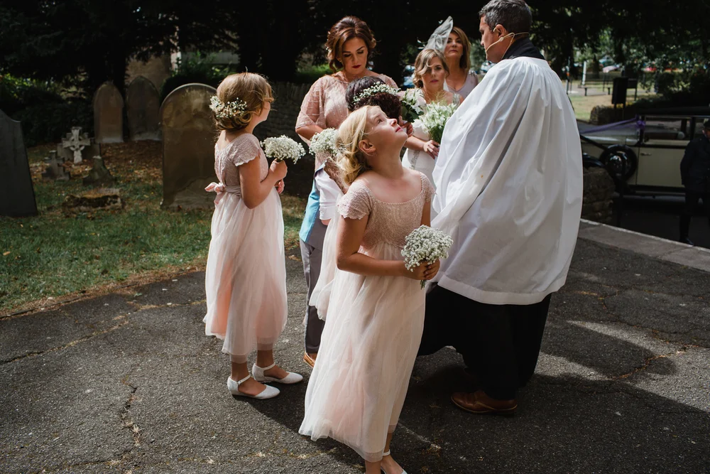 flower girls and the priest in corby