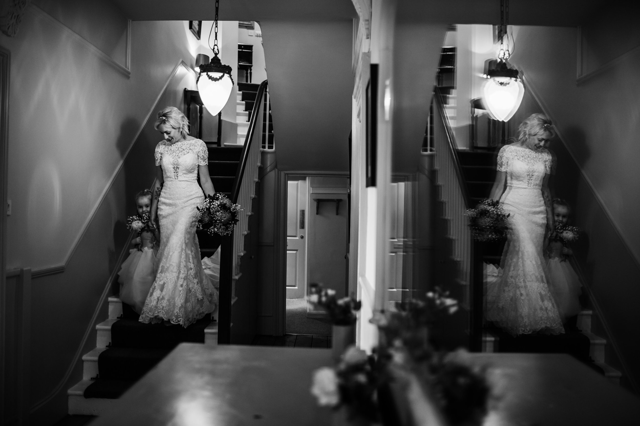 a bride and her daughter walk to a wedding ceremony at rosevine hotel cornwall 
