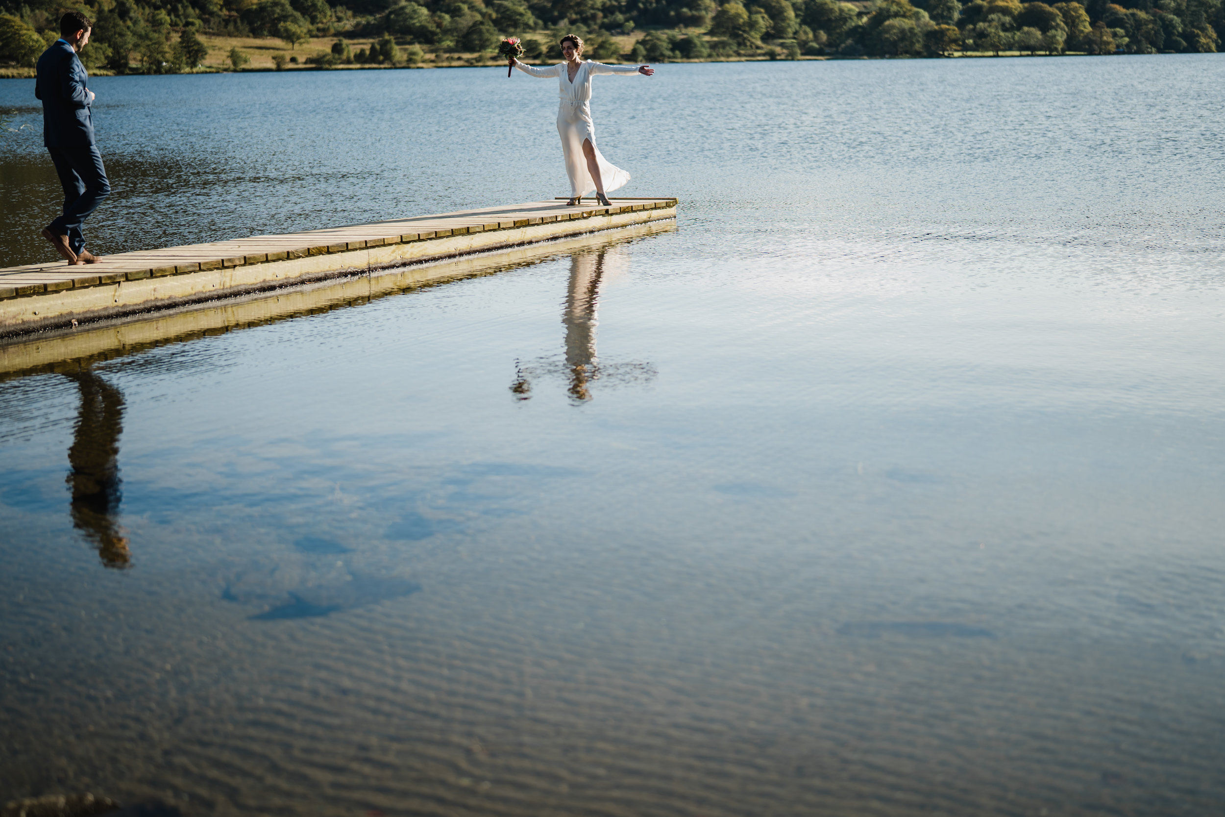 a bride an groom in a lake in snowdonia