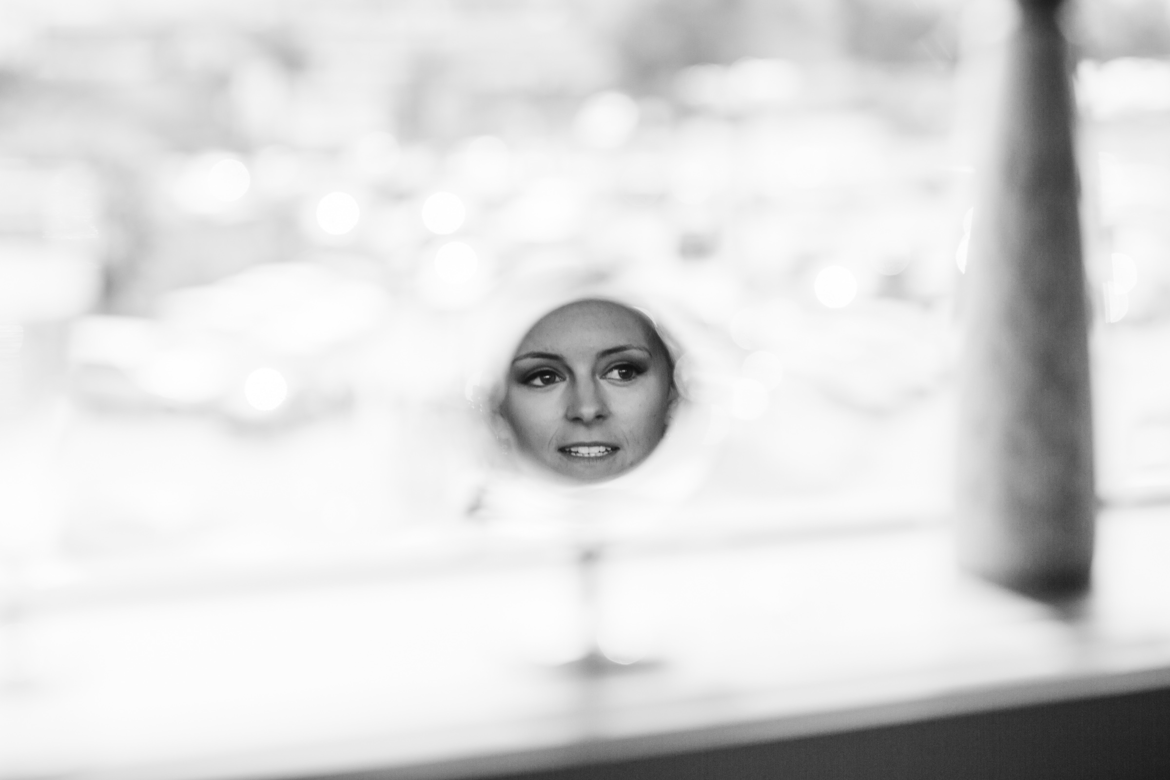 a bride gets ready reflected in a mirror at the Clayton hotel birmingham