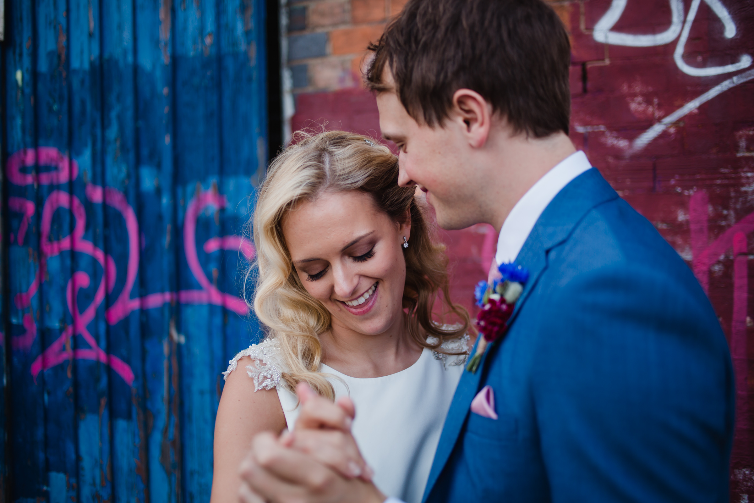 a bride, a groom, graffii in Digbeth Birmingham 