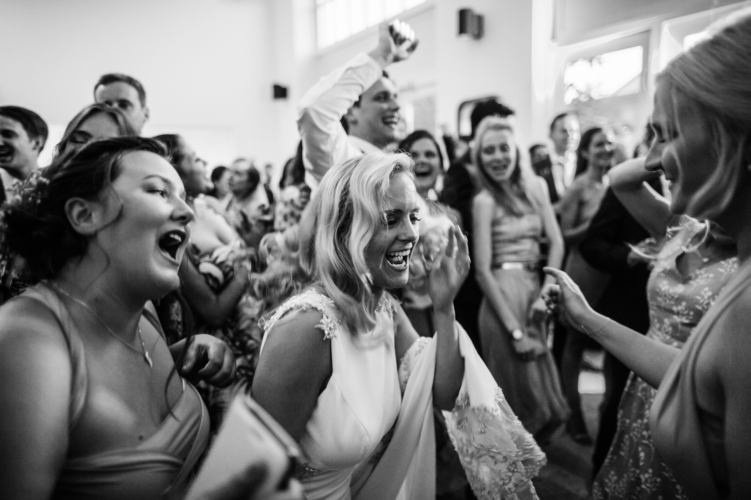 a bride dances hard with her wedding guests at fazeley studios Birmingham 