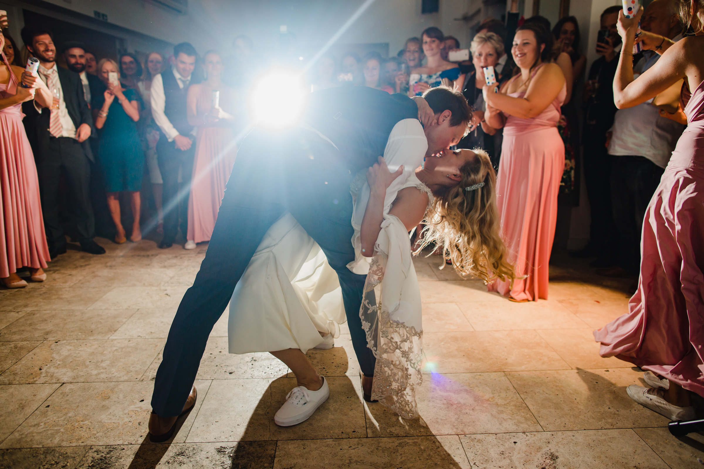 a groom dips his bride during their first dance at fazeley studios digbeth Birmingham 