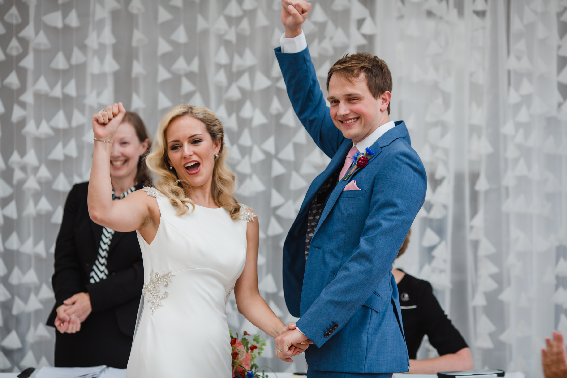 a cheer goes up as a bride and groom are married at fazeley studios birmingham