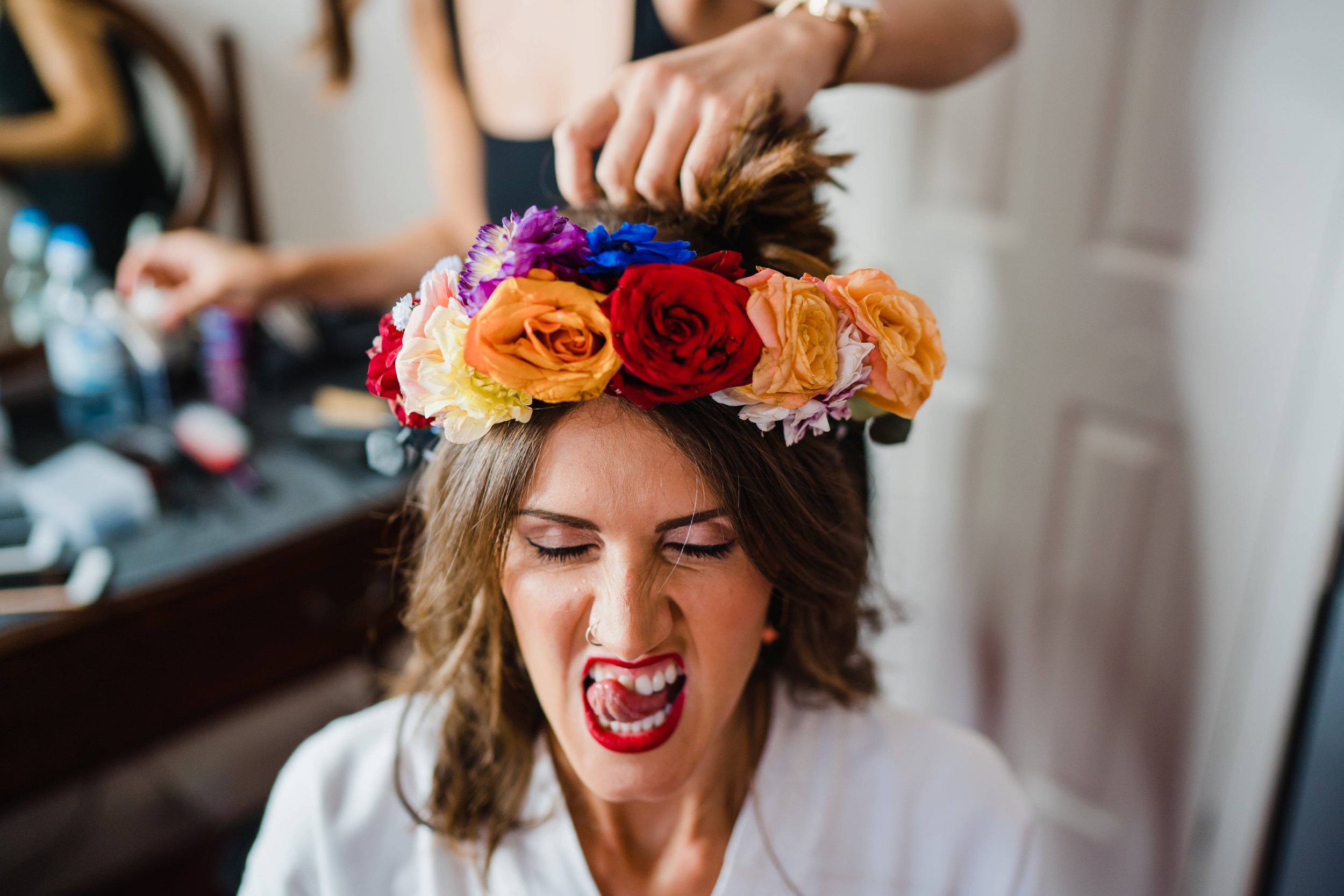 Bride has her flower crown fitted on the morning of her wedding.