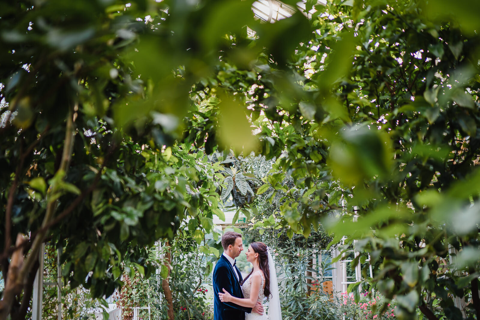  a bride and groom in the Orangery at Wiston House