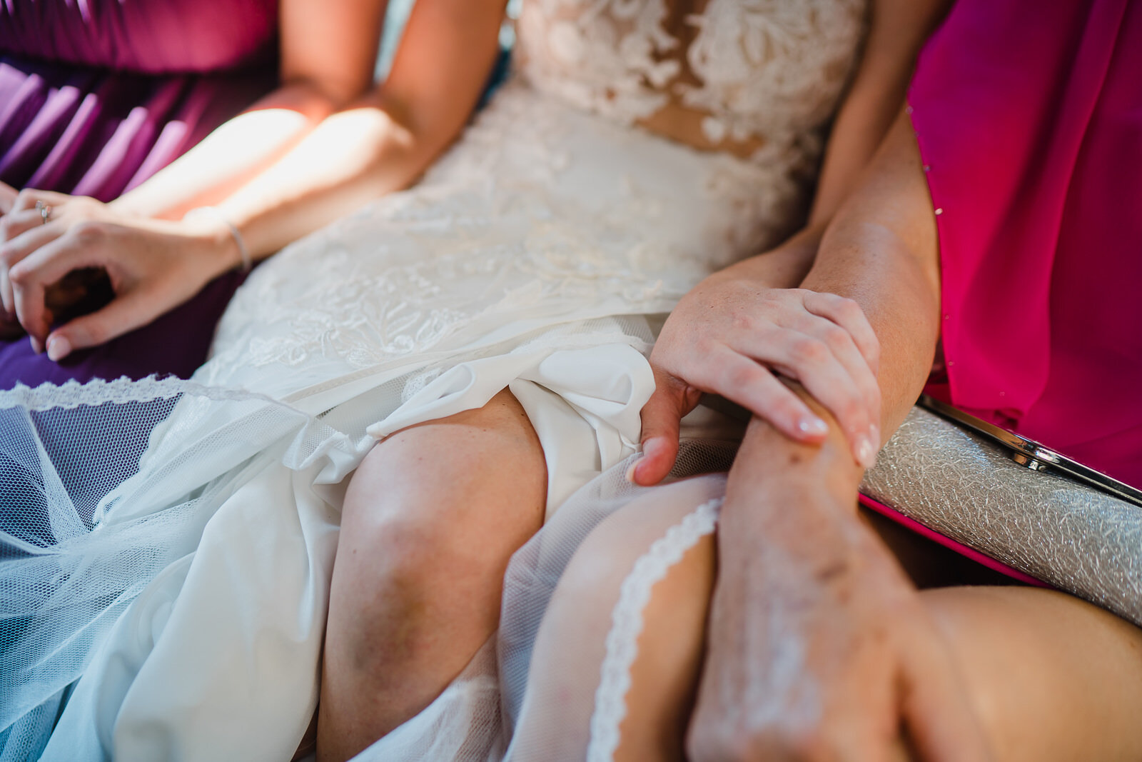 a bride, her mum and her sister in a cab in london