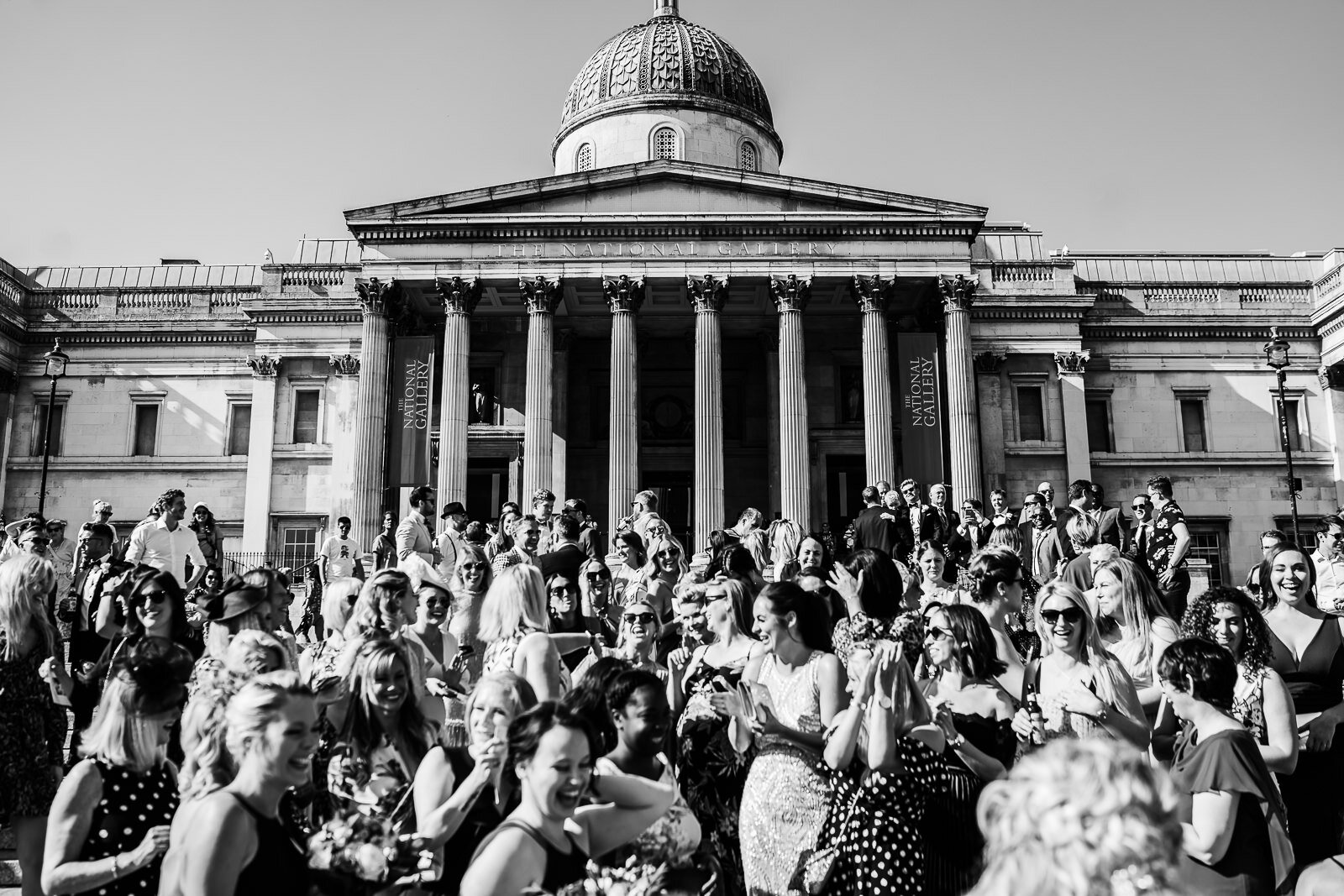 a wedding party in Trafalgar Square london 