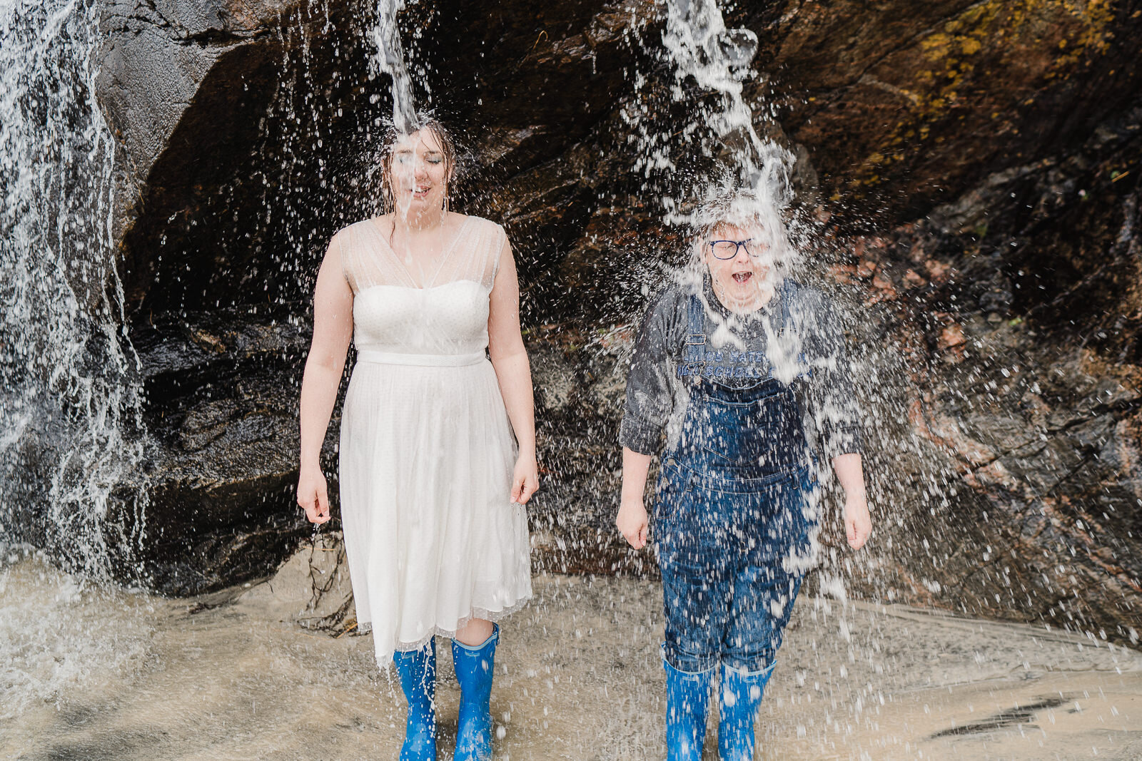 two brides under a waterfall on the isle os Sky