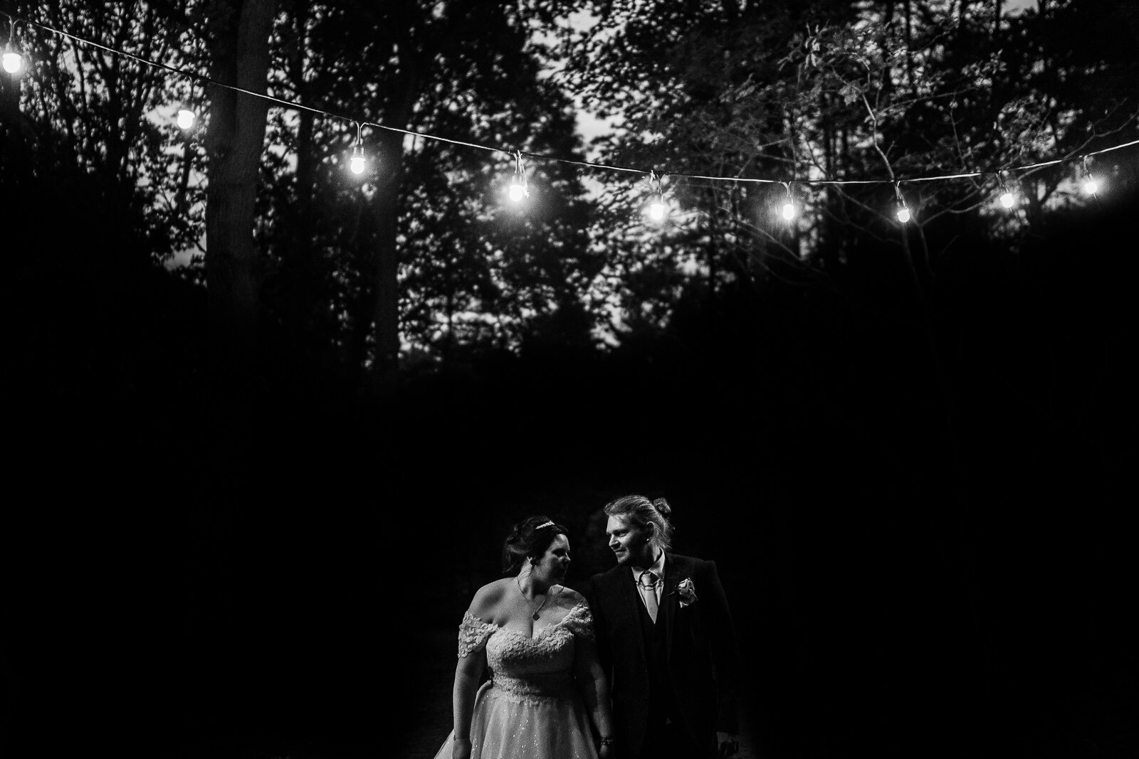 a bride an groom shot at night in delamere forest