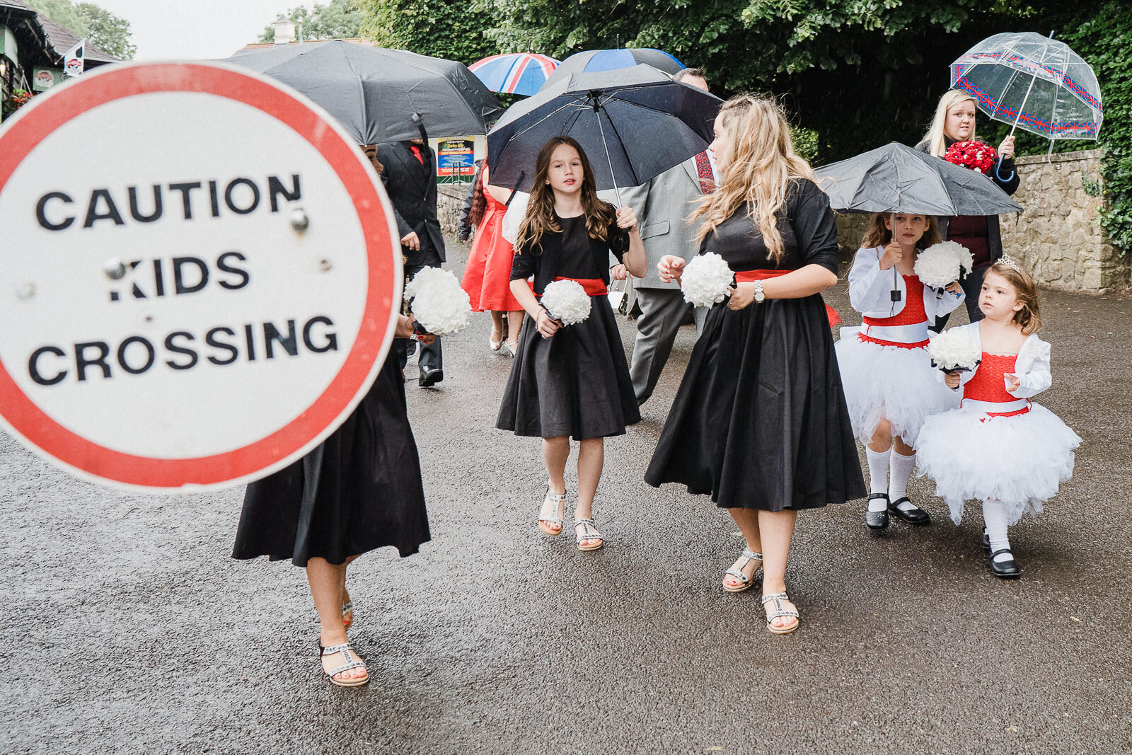 children crossing the road at cheddar gorge