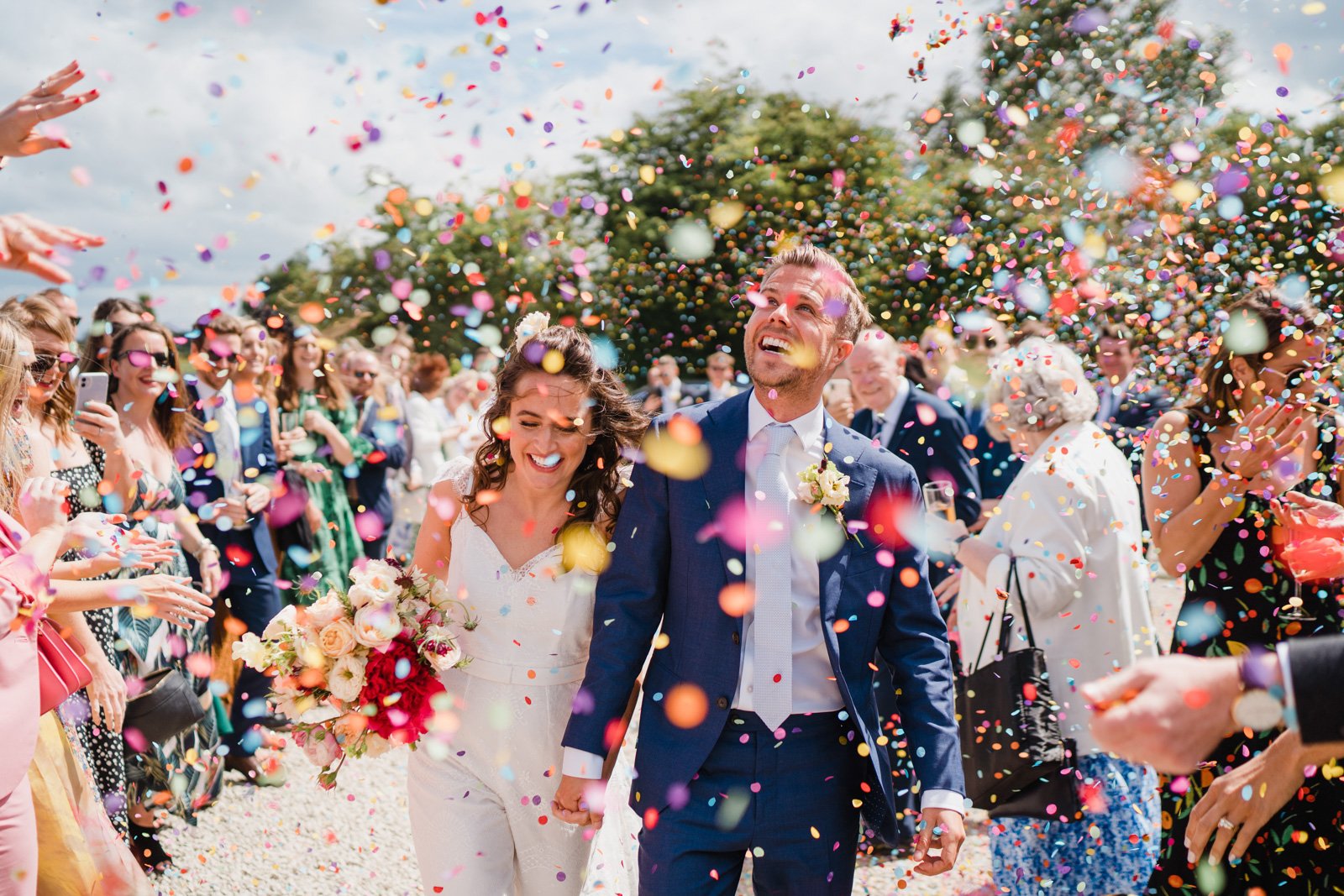 Sunlit confetti moment - 2022 wedding round up no nonsense heartfelt wedding photography leeallenphotos 