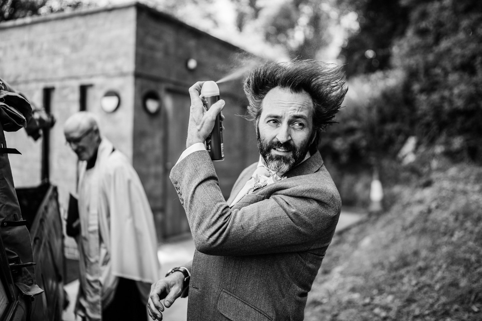 a groom applies hairspray - 2022 wedding round up no nonsense heartfelt wedding photography leeallenphotos