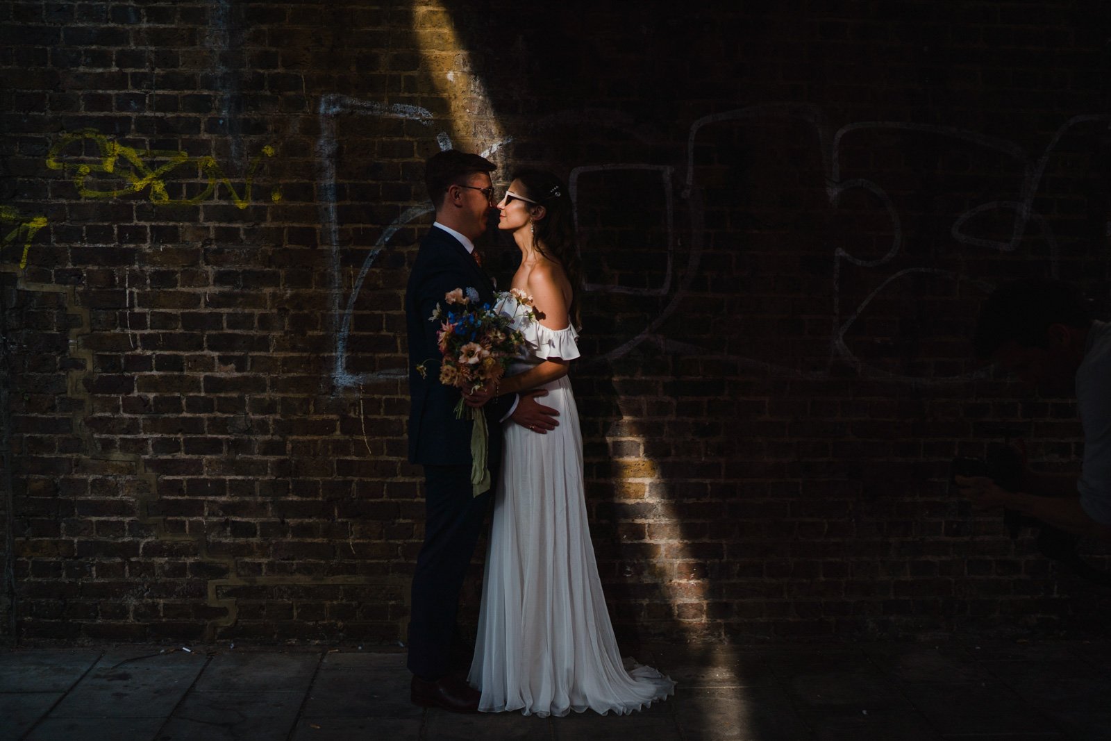 a couple in shard of light outside 100 barrington - 2022 wedding round up no nonsense heartfelt wedding photography leeallenphotos