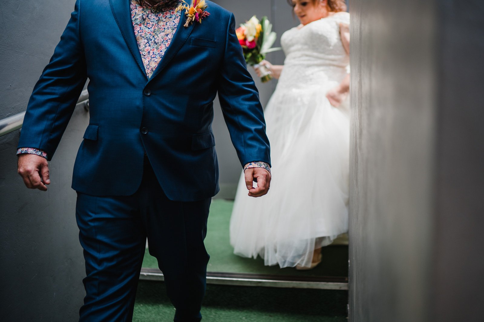 bride and groom leave the old library  in Digbeth - 2022 wedding round up no nonsense heartfelt wedding photography leeallenphotos