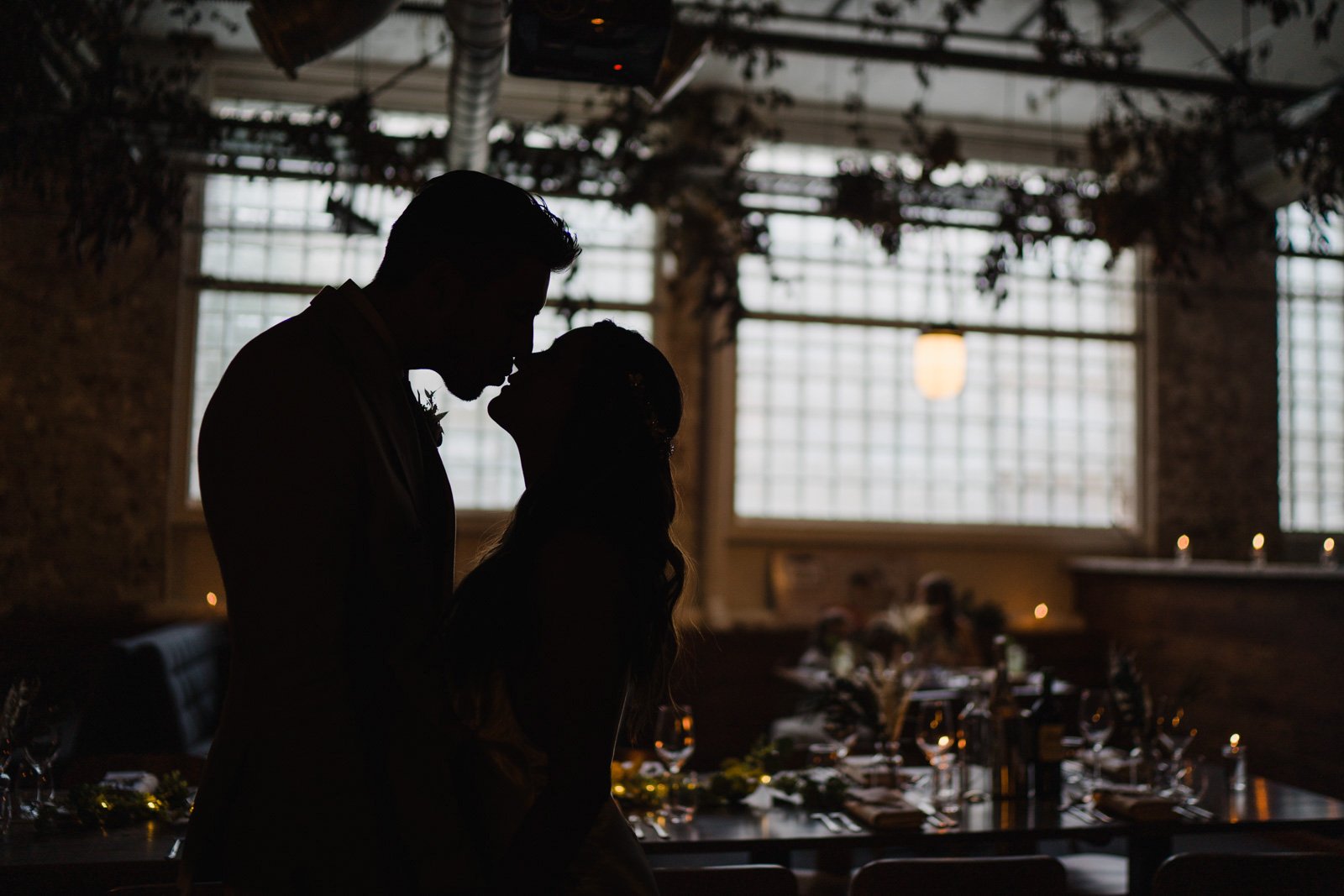 a bride and groom kiss at jones and sons in London - 2022 wedding round up no nonsense heartfelt wedding photography leeallenphotos