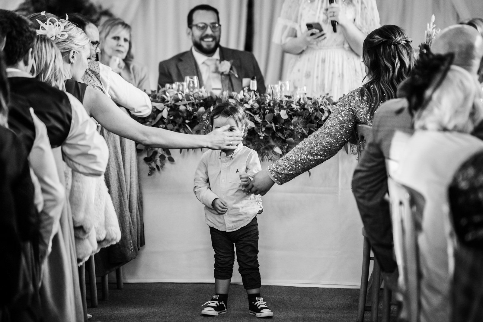 small child during the speeches of a wedding - 2022 wedding round up no nonsense heartfelt wedding photography leeallenphotos