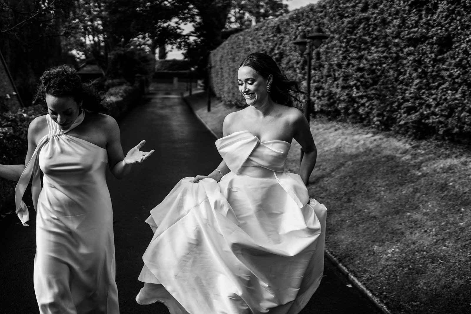 two brides walk to their wedding reception - 2022 wedding round up no nonsense heartfelt wedding photography leeallenphotos