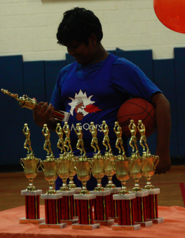 One our kids receiving a trophy for their hard work!