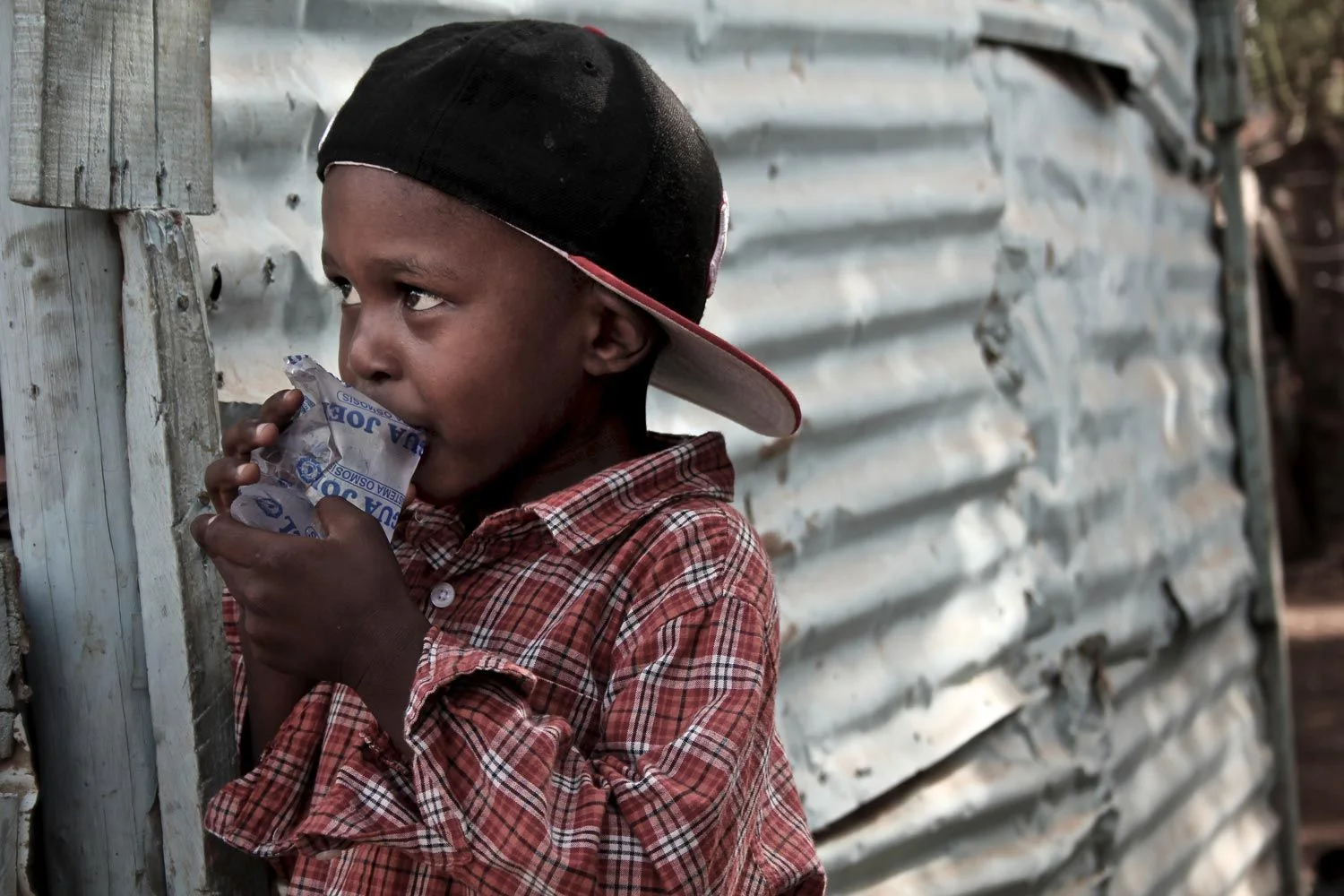 1500x1000-Dominican-Boy-Water-Bag.jpg