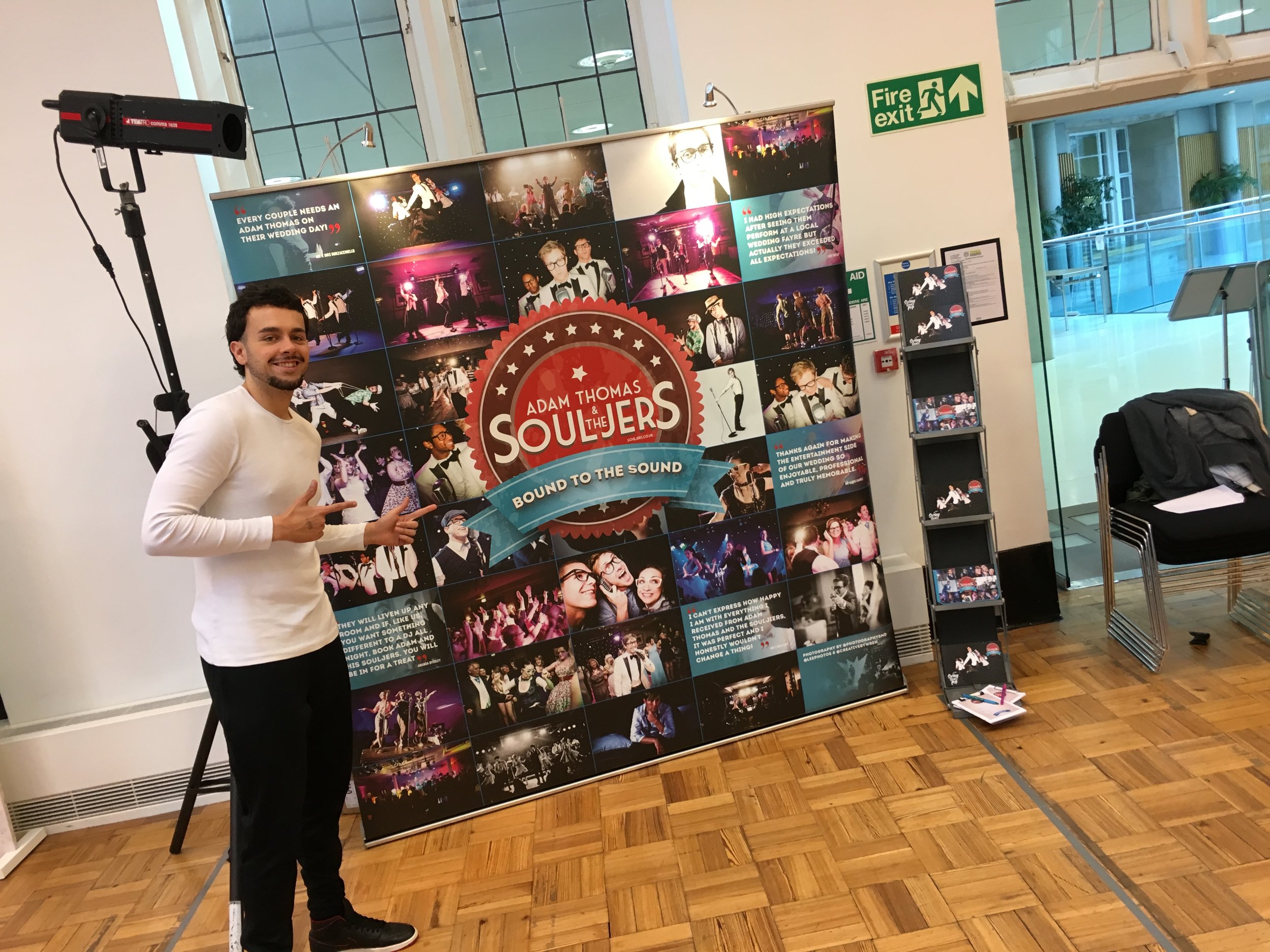 Jordan showing off our funky collage during set up!