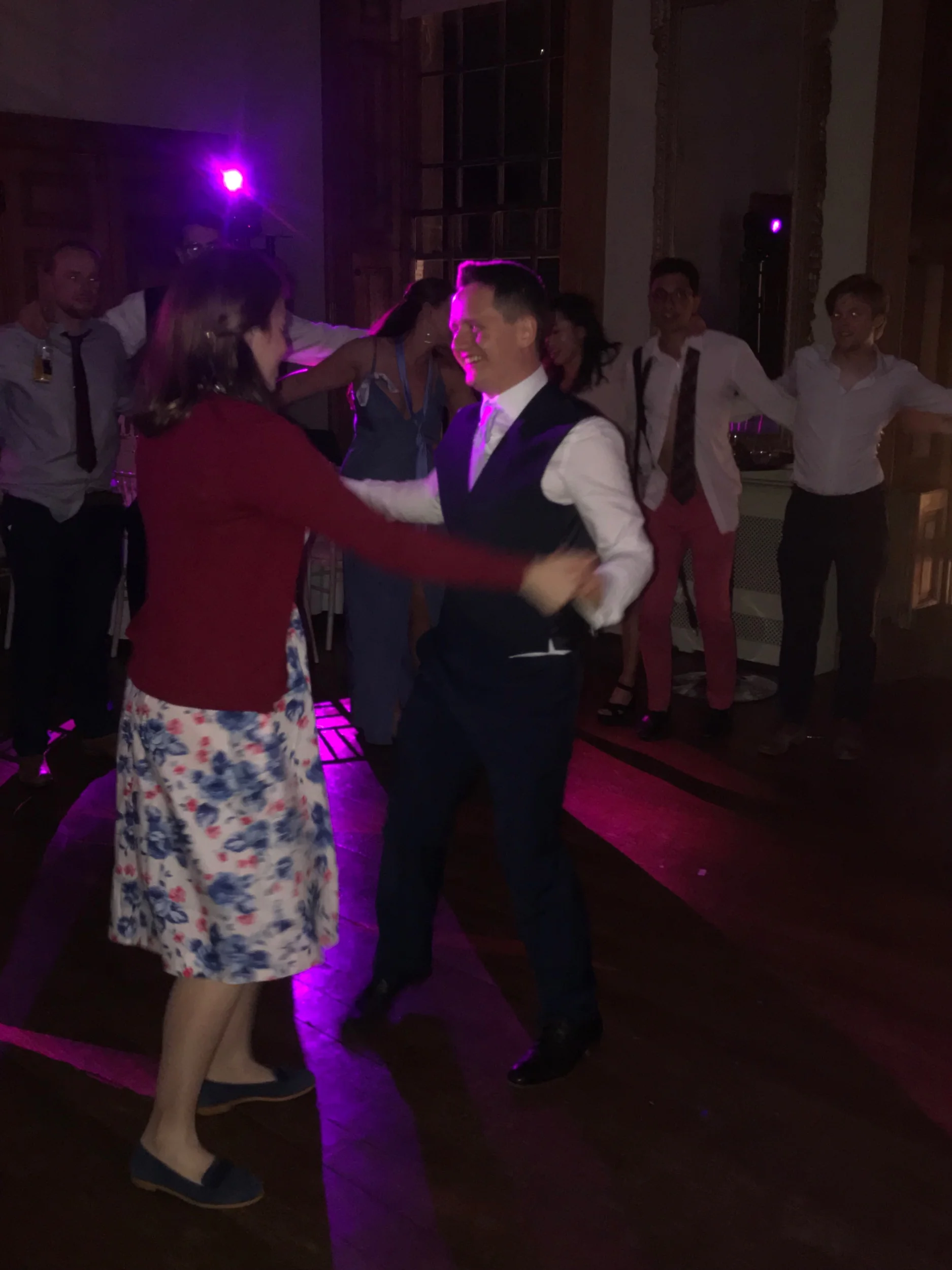 Emma and Joe surrounded by their loved ones on the dance floor, after slipping into something a little more comfortable!