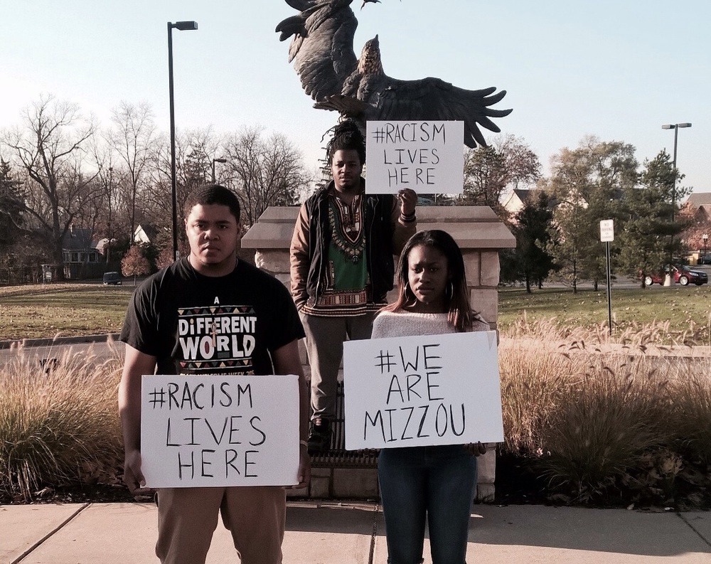 Eastern Michigan University students hold protest signs in front of the Student Center 11/12/15