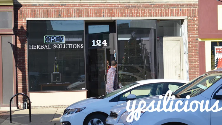 The storefront of Herbal Solutions in Downtown Ypsilanti, MI