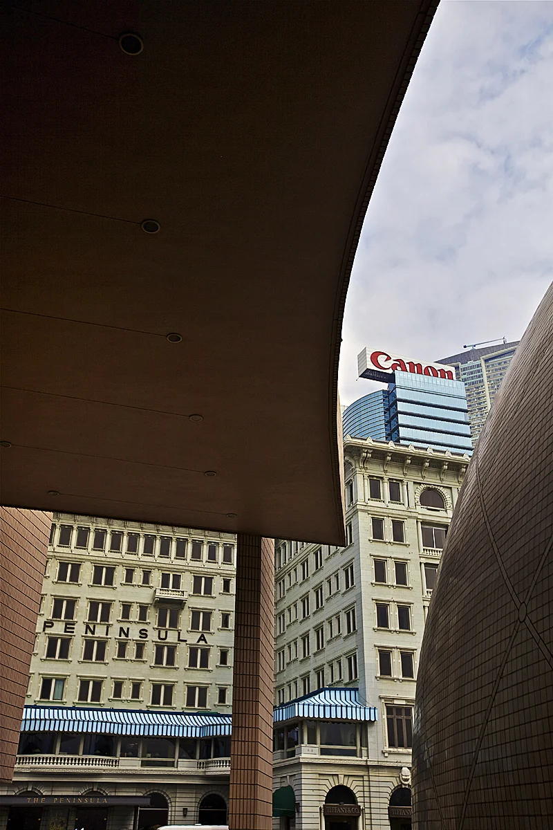 the iconic peninsula hotel on kowloon plays backdrop to abstract shapes from the hong kong museum of art