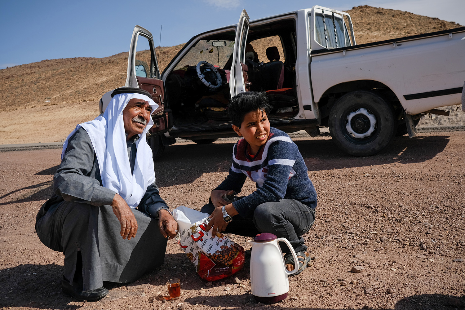  Tea break with our driver and his son on the way to Petra, Jordan. 