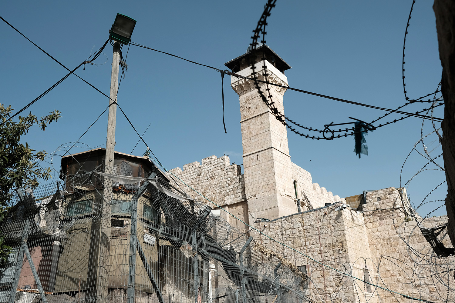  Hebron: Tomb of the Patriarchs/Ibrahimi Mosque is considered the burying place of Abraham. The structure is separated by heavy security into a synagogue and a mosque. In 1994, an American-Israeli murdered 29 muslims gathered for prayer in the mosque