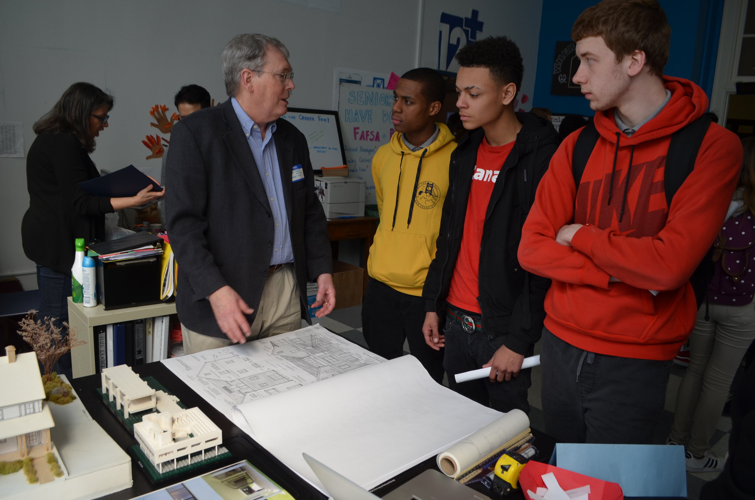 Students talk to an architect.