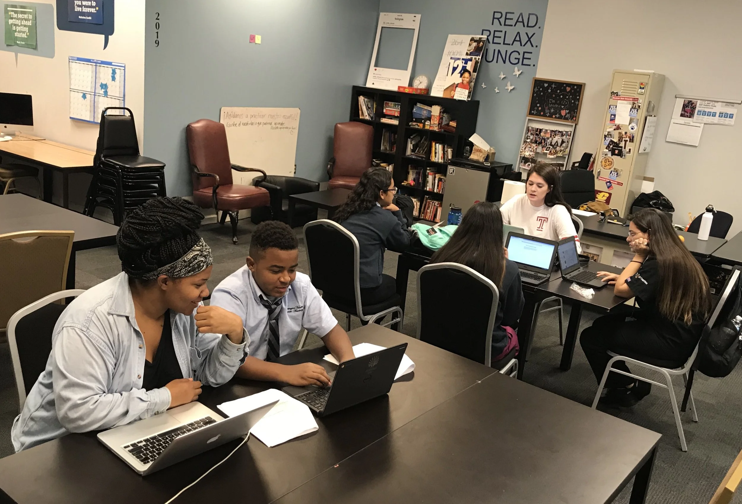 Shay and co-Fellow Devon (far right) works students during a workshop in Kensington Health Science’s PLUS Center.